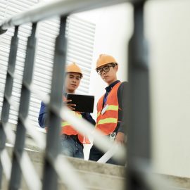 Construction engineers discussing work