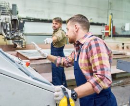 Worker Pushing STOP Button in Emergency